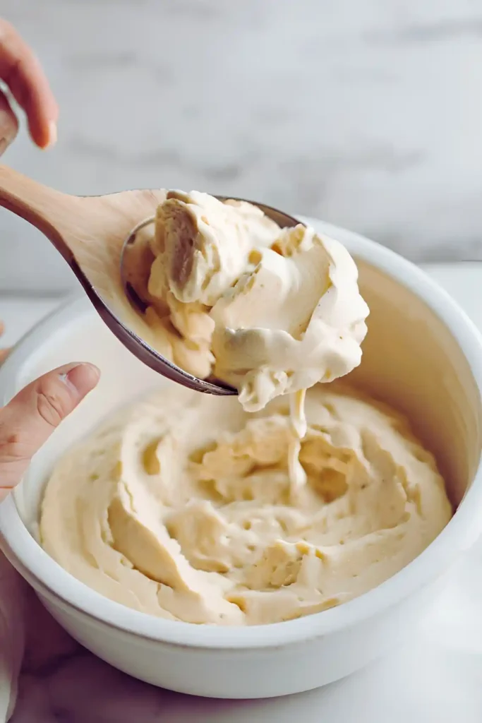 Mixing cookie dough with sour cream