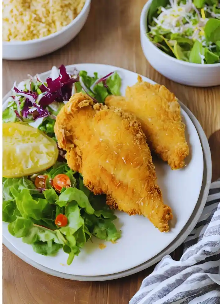 Floured chicken in an air fryer