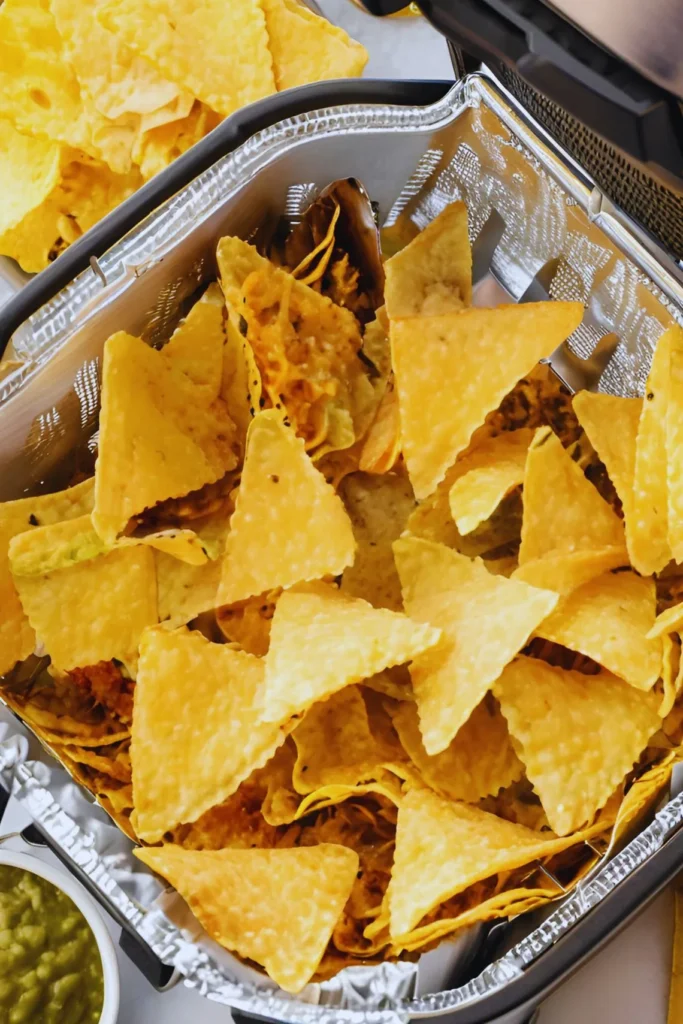 Air fryer nachos cooking in basket